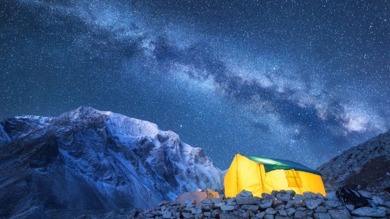 milky-way-yellow-glowing-tent-and-mountains-PSVAVWB.jpg